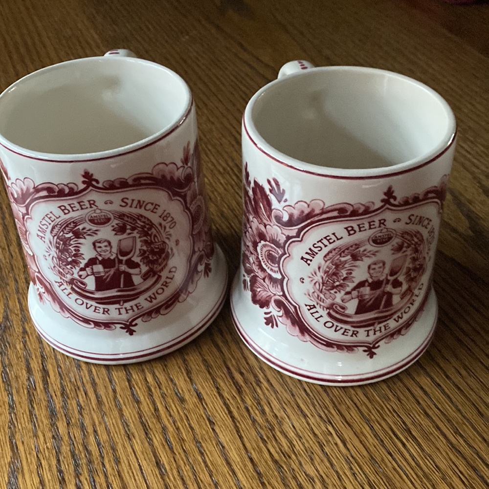 PAIR OF MATCHING VINTAGE BEER STEINS MADE IN HOLAND.,